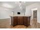 Open-concept kitchen island with seating and storage, seamlessly connecting to the living area at 6392 Highway 378, Conway, SC 29527
