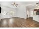 Bright living area with hardwood floors and a view of the kitchen and front entrance at 6392 Highway 378, Conway, SC 29527