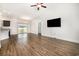 Open-concept living area with hardwood floors and natural light, seamlessly connects the kitchen at 6392 Highway 378, Conway, SC 29527