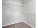 Walk in closet with shelves and neutral carpet at 643 Snowy Owl Way, Conway, SC 29527