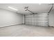 Spacious garage with an automatic door and concrete flooring at 643 Snowy Owl Way, Conway, SC 29527