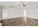 Bright and airy living area boasts wood-look flooring, modern ceiling fan, and open access to other rooms at 643 Snowy Owl Way, Conway, SC 29527