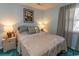 A cozy bedroom with a queen size bed, bedside tables, and window with curtains at 646 Tupelo Ln. # 4E, Longs, SC 29568