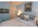 Comfortable bedroom featuring a queen-sized bed with decorative pillows and complementary decor at 646 Tupelo Ln. # 4E, Longs, SC 29568