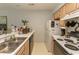 Kitchen featuring ample countertop space, neutral cabinets, and standard appliances at 646 Tupelo Ln. # 4E, Longs, SC 29568