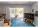 Relaxing living room with a sliding door opening onto the balcony, offering seamless indoor-outdoor living at 646 Tupelo Ln. # 4E, Longs, SC 29568