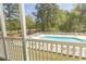 A community pool with plenty of poolside seating and lush landscaping at 646 Tupelo Ln. # 4E, Longs, SC 29568