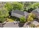 Aerial view of a beige apartment complex surrounded by lush landscaping at 679 Riverwalk Dr. # 201, Myrtle Beach, SC 29579