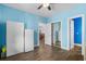 Spacious bedroom with hardwood floors, large closets, and white cabinets at 679 Riverwalk Dr. # 201, Myrtle Beach, SC 29579