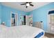 Spacious bedroom with attached bath, access to the patio, and a ceiling fan at 679 Riverwalk Dr. # 201, Myrtle Beach, SC 29579
