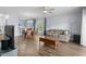 Open-concept living room with hardwood floors, a large sofa, and connecting kitchen at 679 Riverwalk Dr. # 201, Myrtle Beach, SC 29579