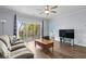 Comfortable living room with a view of the patio and a mounted flatscreen TV at 679 Riverwalk Dr. # 201, Myrtle Beach, SC 29579