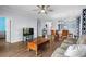 Spacious living room with hardwood floors, ceiling fan, and cozy seating area at 679 Riverwalk Dr. # 201, Myrtle Beach, SC 29579