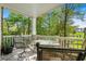 Relaxing patio area with a table and chairs overlooking the lush green golf course at 679 Riverwalk Dr. # 201, Myrtle Beach, SC 29579