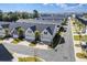 An aerial view showing the layout of homes with driveways and palm trees in a neighborhood at 800 Monarch Dr. # 46, Myrtle Beach, SC 29588