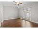Light-filled bedroom featuring hardwood floors and a patio door at 800 Monarch Dr. # 46, Myrtle Beach, SC 29588