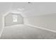 Spacious bedroom featuring neutral carpet, walls, and a window letting in natural light at 800 Monarch Dr. # 46, Myrtle Beach, SC 29588