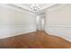 Traditional dining room featuring hardwood floors, white wainscoting, and a decorative chandelier at 800 Monarch Dr. # 46, Myrtle Beach, SC 29588