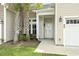Charming home exterior with palm trees, a well-manicured lawn, and a cozy front porch at 800 Monarch Dr. # 46, Myrtle Beach, SC 29588