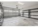 A clean and organized two-car garage with storage racks at 800 Monarch Dr. # 46, Myrtle Beach, SC 29588