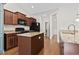 Open kitchen with a large island, granite countertops, and wooden cabinets at 800 Monarch Dr. # 46, Myrtle Beach, SC 29588