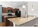 A modern kitchen features granite counters, an island, and stainless steel appliances at 800 Monarch Dr. # 46, Myrtle Beach, SC 29588