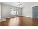 Bright and airy living room features a large window and beautiful hardwood floors at 800 Monarch Dr. # 46, Myrtle Beach, SC 29588