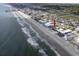 Aerial view showcasing the condo's location, situated on the beach with ocean view at 806 N Waccamaw Dr. # 104, Murrells Inlet, SC 29576