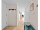 Hallway with tiled floors, a decorated bench, and access to other rooms at 806 N Waccamaw Dr. # 104, Murrells Inlet, SC 29576