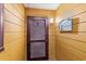 Hallway leading to unit 104 with wood-look wall texture, unit number and beachy decor at 806 N Waccamaw Dr. # 104, Murrells Inlet, SC 29576
