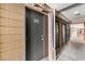 Condo hallway with unit numbers and exterior brick-style siding at 806 N Waccamaw Dr. # 104, Murrells Inlet, SC 29576