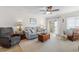 Cozy living room with comfortable seating and access to a private outdoor balcony at 806 N Waccamaw Dr. # 104, Murrells Inlet, SC 29576