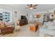 Living room with TV, kitchen access, dining area, and neutral color pallete, making it feel spacious at 806 N Waccamaw Dr. # 104, Murrells Inlet, SC 29576