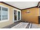 Relaxing condo patio with sliding glass doors to the interior and views of the outside at 806 N Waccamaw Dr. # 104, Murrells Inlet, SC 29576