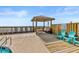 Gorgeous covered gazebo near the pool area with chairs and tables for relaxing at 806 N Waccamaw Dr. # 104, Murrells Inlet, SC 29576