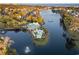 Aerial view showcases the community clubhouse and pool next to a scenic lake at 808 East Coast Ln., North Myrtle Beach, SC 29582