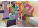 Quirky bathroom features a hand-painted mural, adding a unique and creative touch to the space at 808 East Coast Ln., North Myrtle Beach, SC 29582