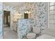 Bathroom featuring floral wallpaper, granite countertop, and a tub at 808 East Coast Ln., North Myrtle Beach, SC 29582