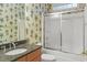 Bathroom vanity sink and glass enclosed bathtub and shower at 808 East Coast Ln., North Myrtle Beach, SC 29582