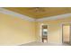Spacious bedroom featuring a ceiling fan, neutral carpet, and yellow walls at 808 East Coast Ln., North Myrtle Beach, SC 29582