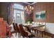 Elegant dining room with modern table setting, chandelier, and large window, perfect for gatherings at 808 East Coast Ln., North Myrtle Beach, SC 29582
