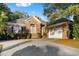 Charming single-Gathering brick home featuring a well-maintained lawn and a spacious driveway leading to a two-car garage at 808 East Coast Ln., North Myrtle Beach, SC 29582