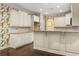 Well-equipped kitchen with ample storage in the white cabinetry and with granite countertops at 808 East Coast Ln., North Myrtle Beach, SC 29582