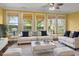 Comfortable living room features a neutral color palette, stylish furnishings, and large windows for natural light at 808 East Coast Ln., North Myrtle Beach, SC 29582