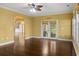 Open living area with wood floors, statement lighting, and french doors leading to the backyard at 808 East Coast Ln., North Myrtle Beach, SC 29582