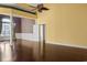 Open living room with hardwood floors and high ceilings, and beautiful chandelier at 808 East Coast Ln., North Myrtle Beach, SC 29582