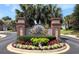 Seaside Plantation entrance sign with manicured landscaping and American flags at 808 East Coast Ln., North Myrtle Beach, SC 29582