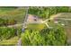 Aerial view of the property showing two houses, road frontage, and surrounding trees at 814 S Midway Hwy., Johnsonville, SC 29555