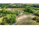 Expansive aerial view showing two new homes on large lots surrounded by lush greenery and farmland at 814 S Midway Hwy., Johnsonville, SC 29555