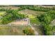 Aerial view showcases two homes on expansive lots with road frontage and surrounding greenery at 814 S Midway Hwy., Johnsonville, SC 29555